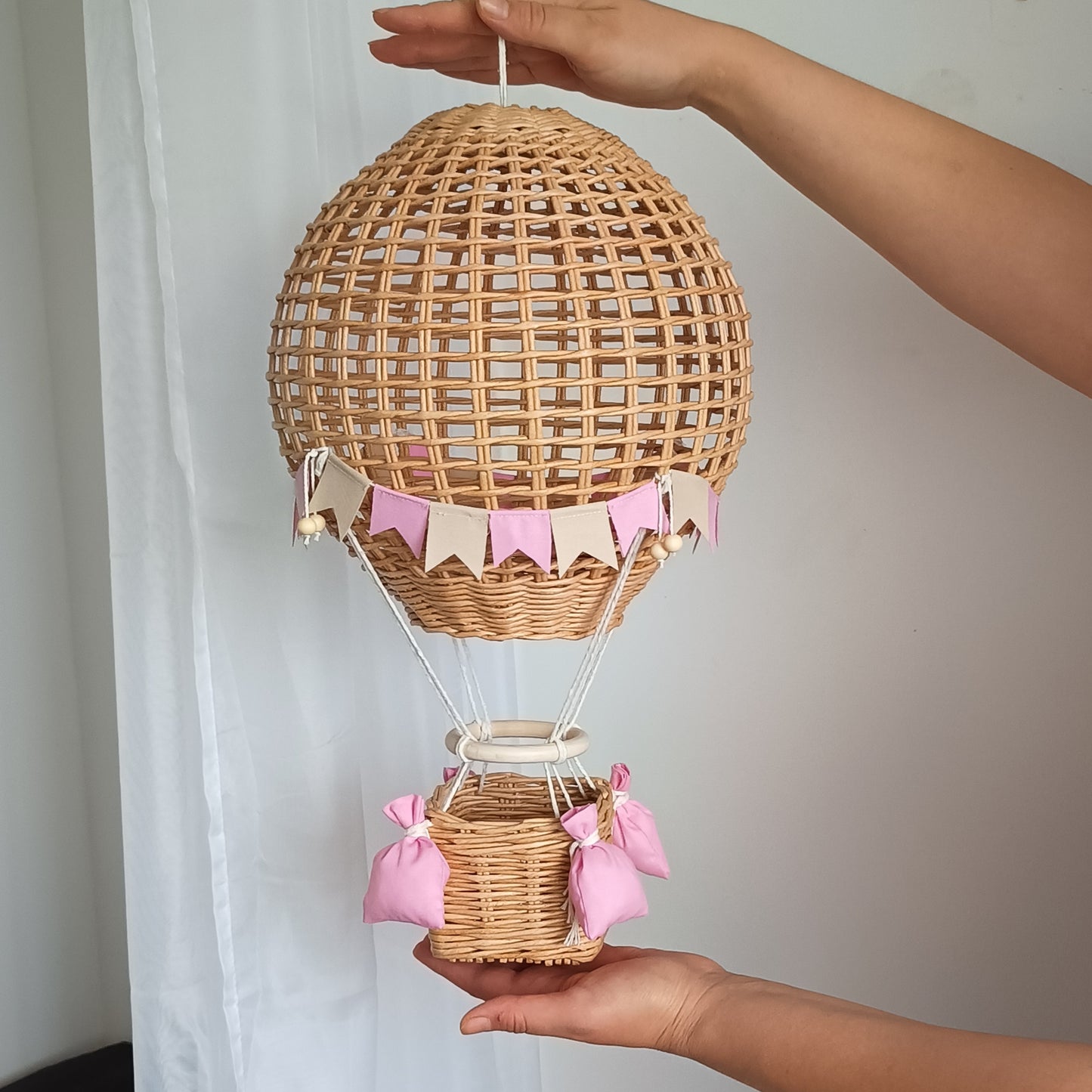 Decorative hot air balloon with basket for a girl's room